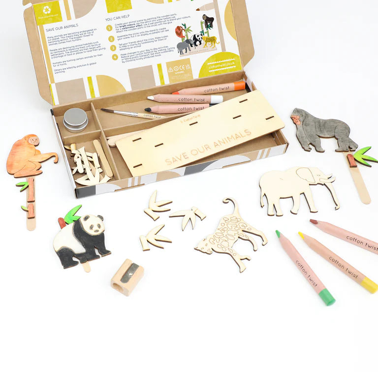 Wooden animal stamps set with packaging and markers on a white background