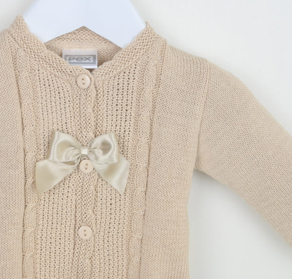 Beige knitted cardigan with a satin bow on a white background