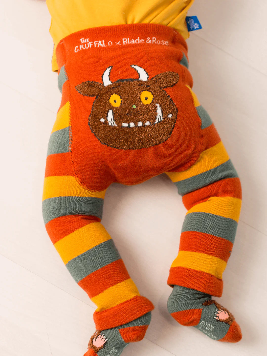 Children's leggings with the Gruffalo character on a white background