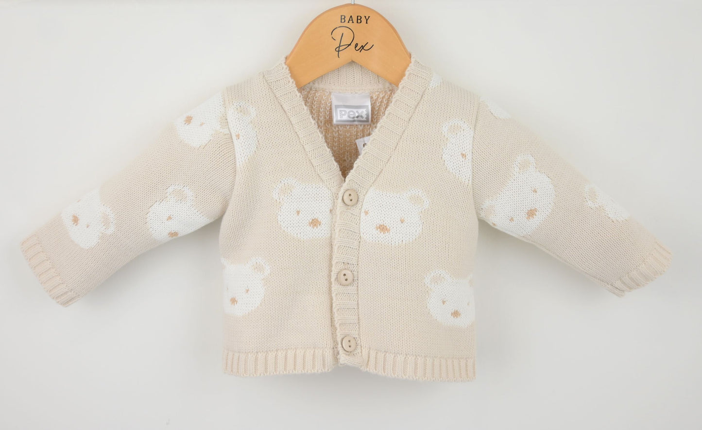 Baby cardigan with bear pattern on a white background