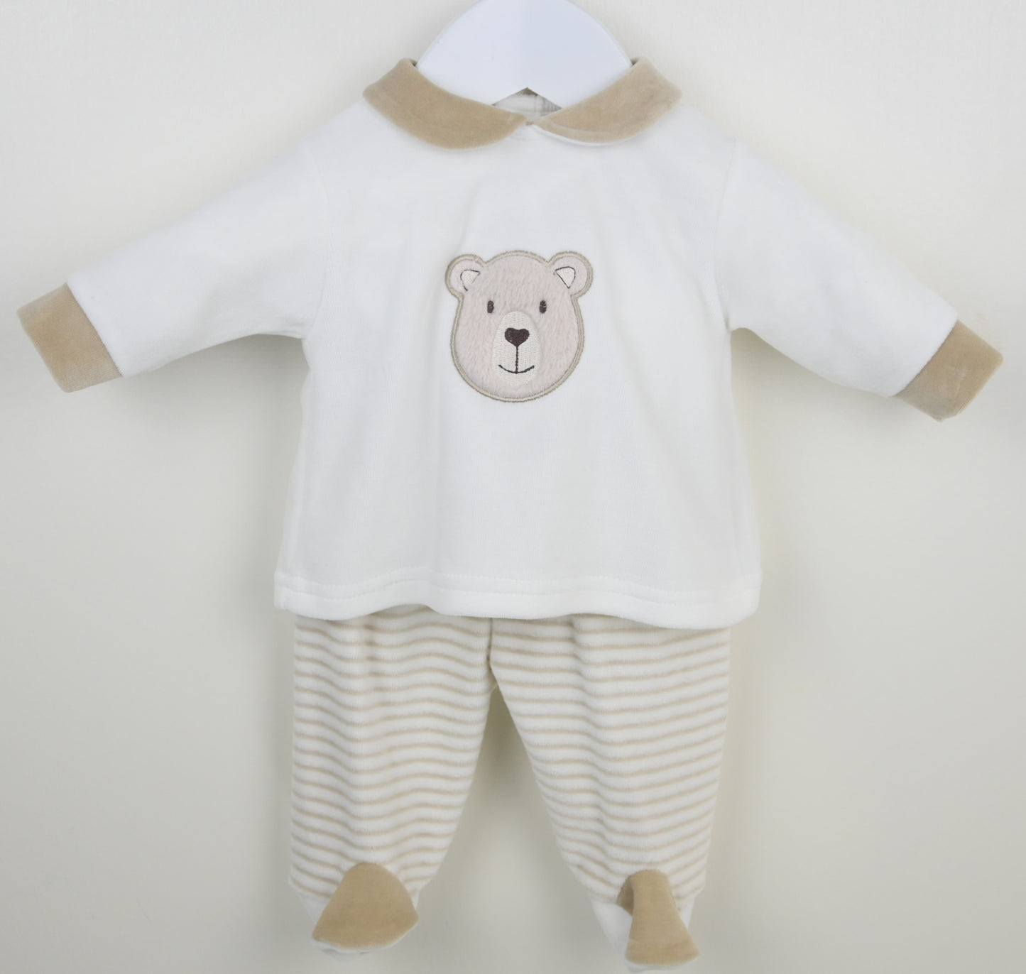 Baby outfit with bear design on a white background