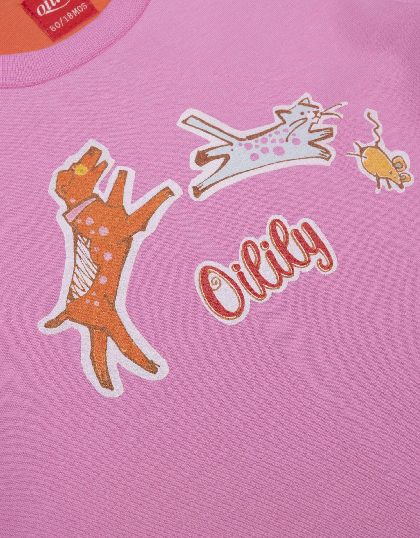 Pink shirt with cartoon characters and 'Ollily' branding on a pink background
