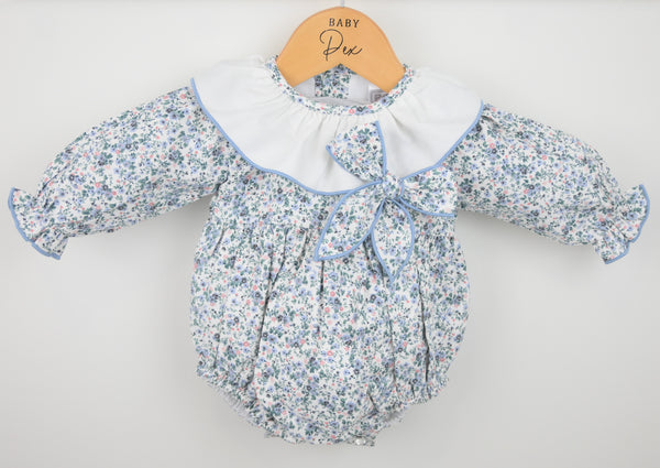 Baby romper with floral pattern on a white background