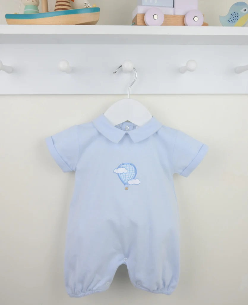 Light blue baby romper with collar and embroidered balloon design on a white background