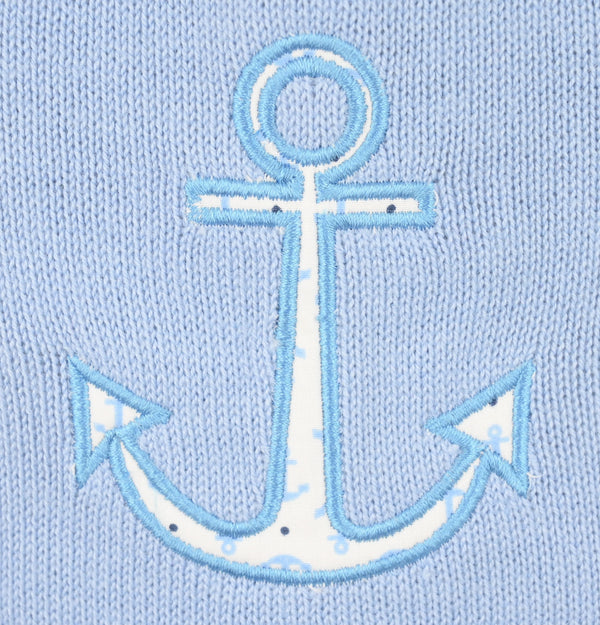 Embroidered anchor design on a light blue fabric background
