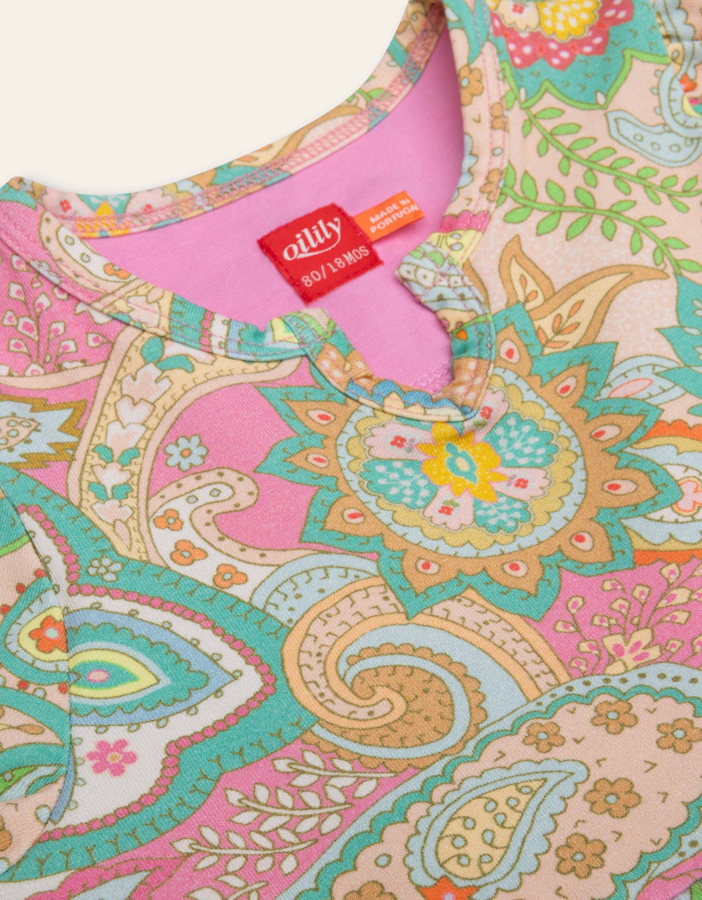 Colorful patterned fabric with a visible ' Oilily' tag on a white background