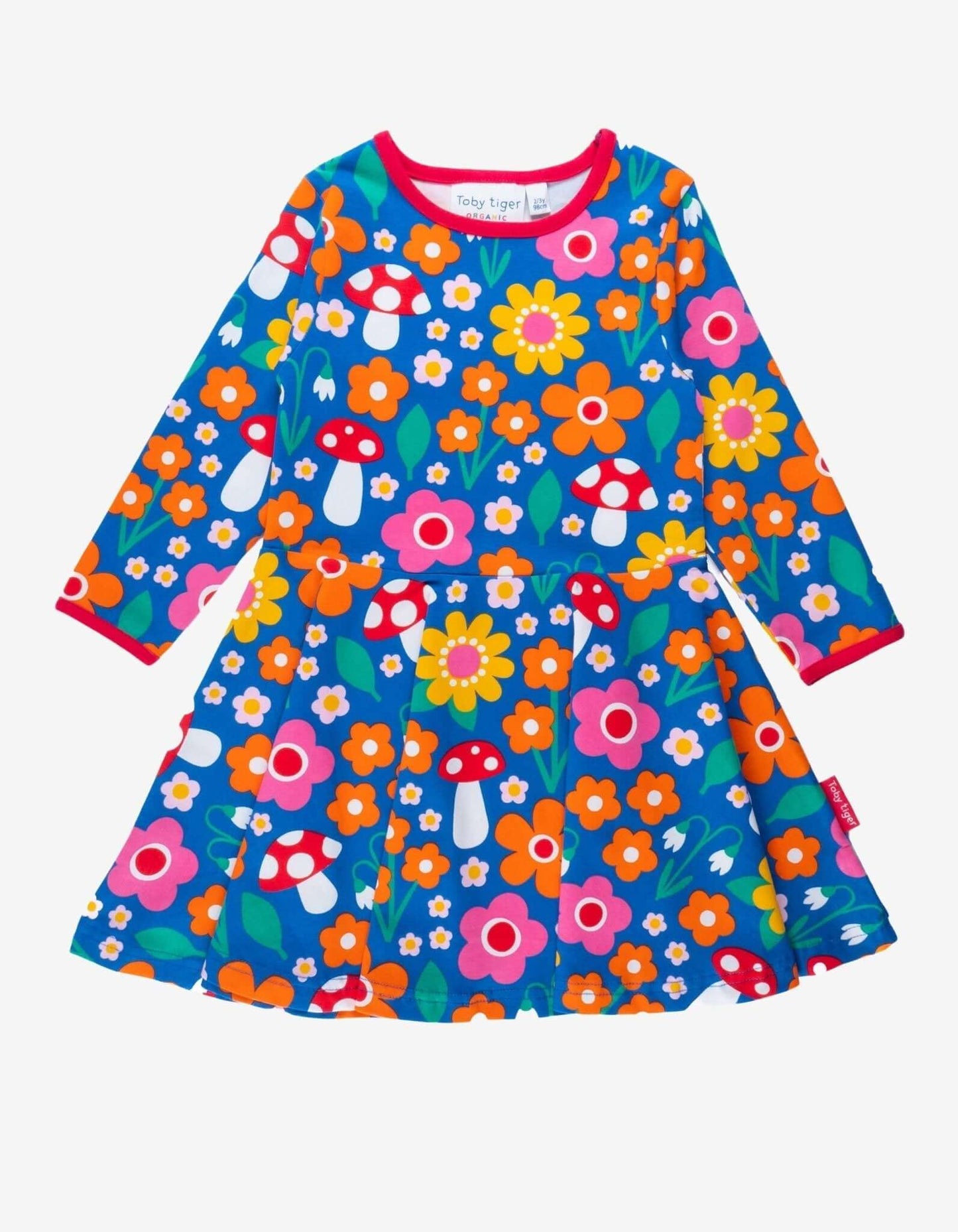 Colorful children's Toby Tiger dress with floral and mushroom pattern on a white background