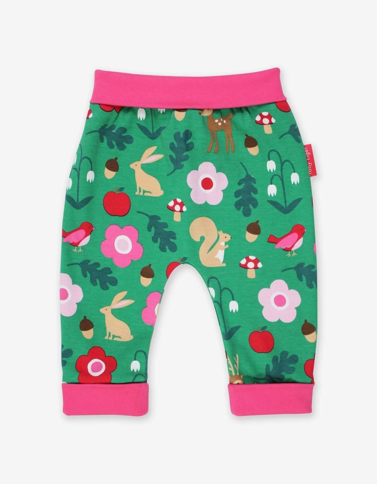Baby yoga pants with a forest animal pattern on a green background