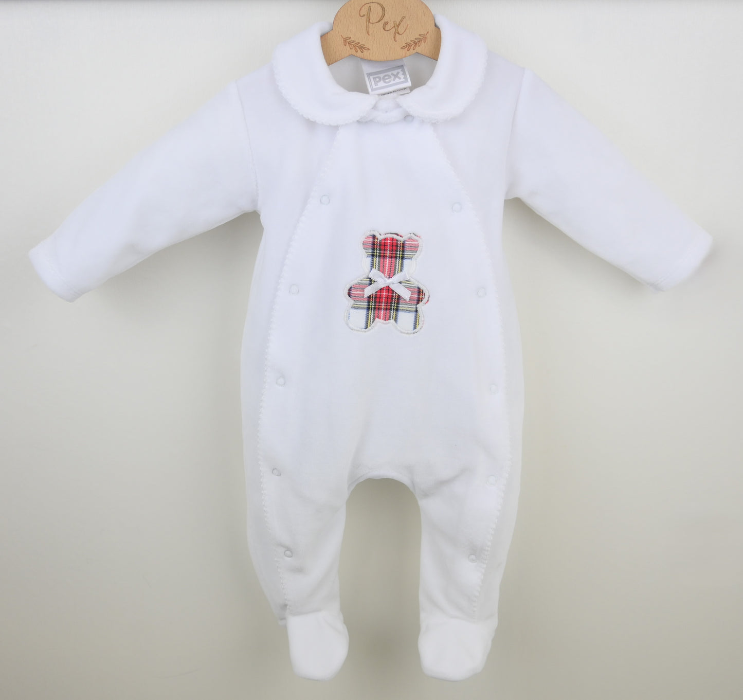 Soft velour fabric texture of the Pex Tartan Ted baby sleepsuit