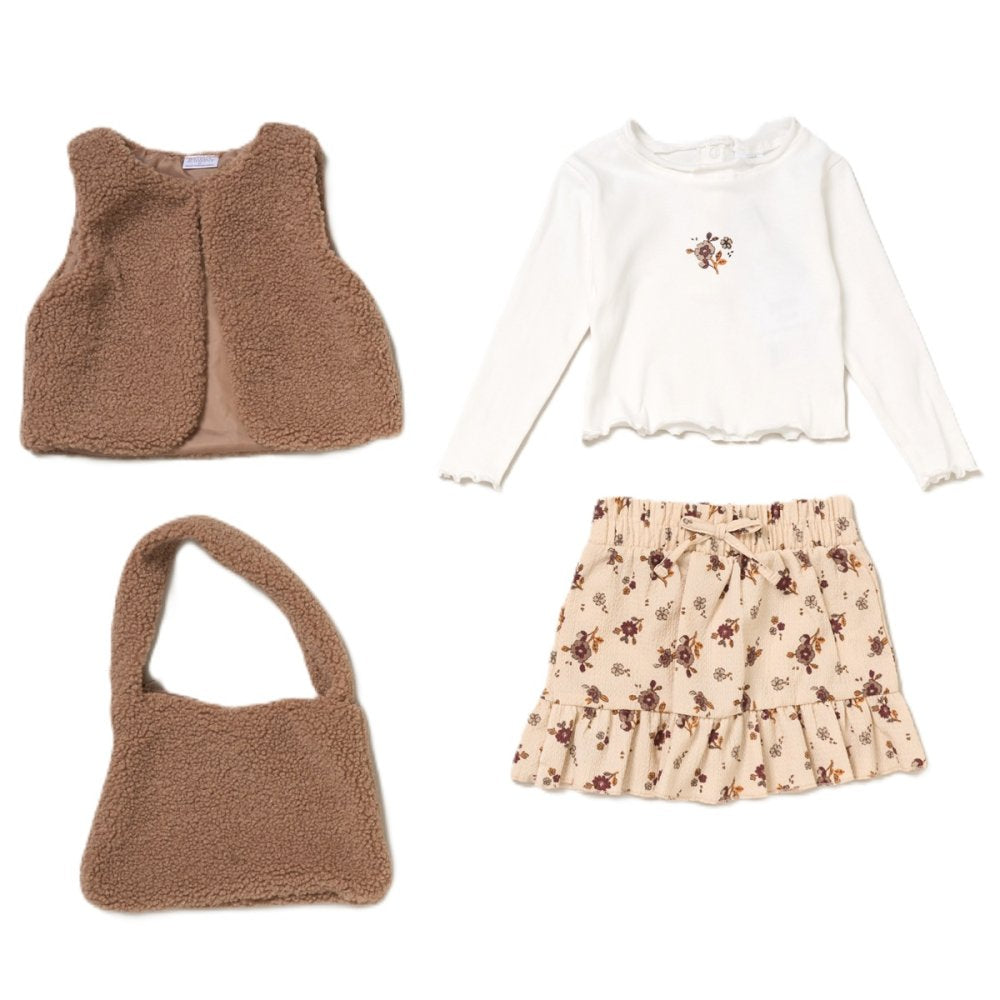 Set of children's clothing including a brown gilet, white long-sleeve top with floral design, beige skirt with floral pattern, and brown bag on a white background.