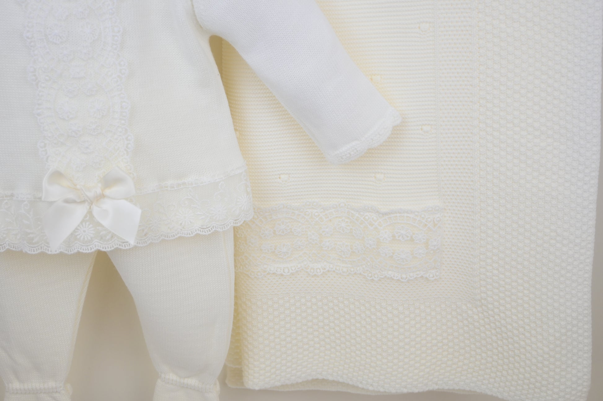 Ivory baby outfit with pants and a coordinated shawl