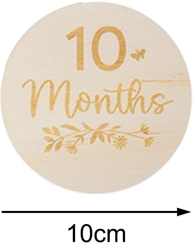 Round wooden milestone with '10 Months' engraving on a white background