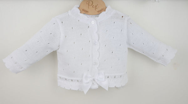White baby cardigan with a textured pattern on a light gray background