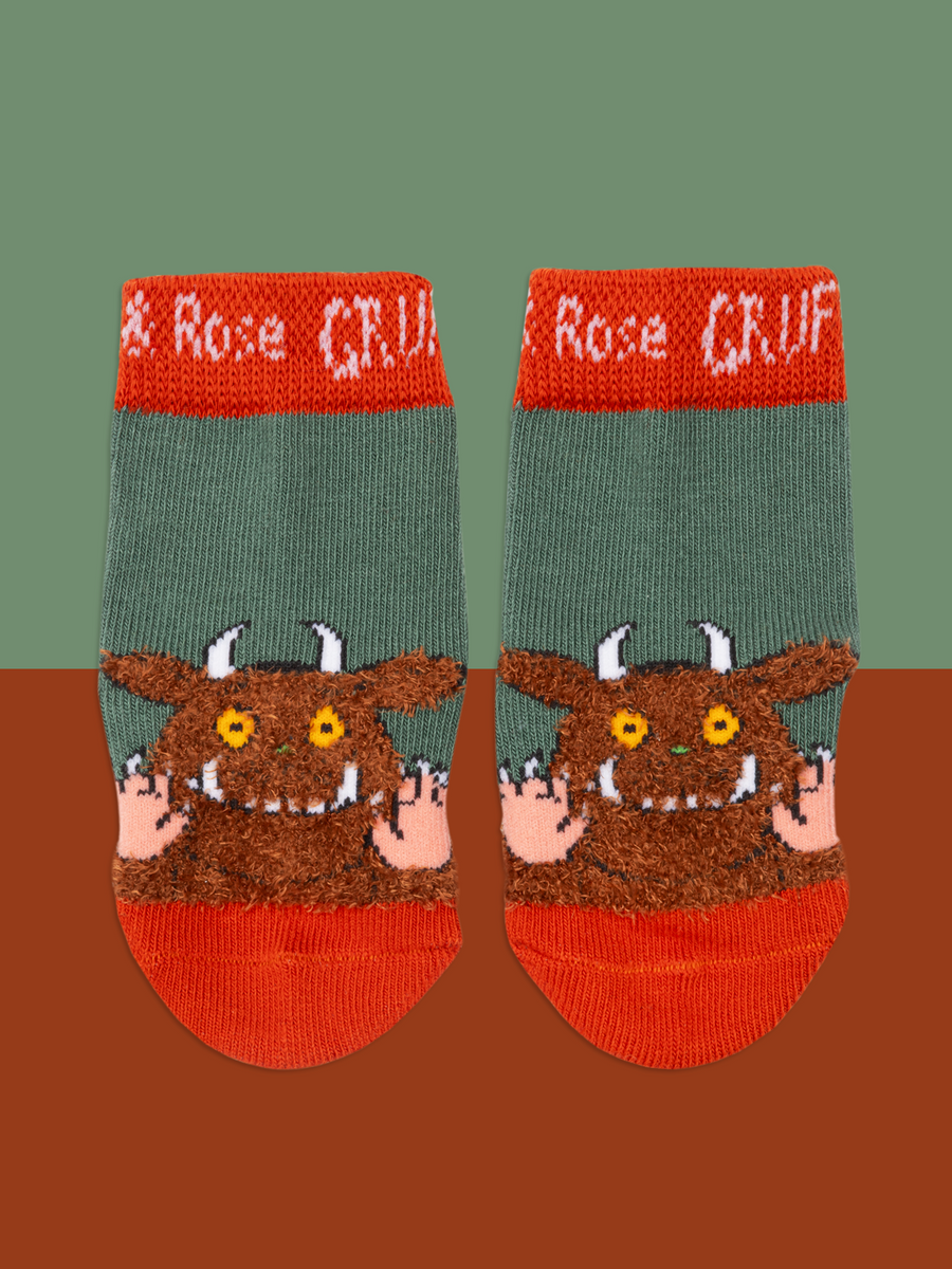 Pair of childrens socks with the Gruffalo character on a brown background