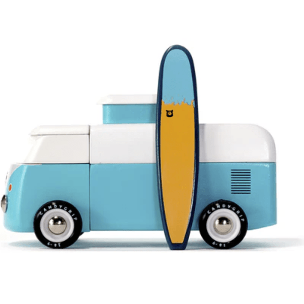 Toy van with a surfboard on a white background