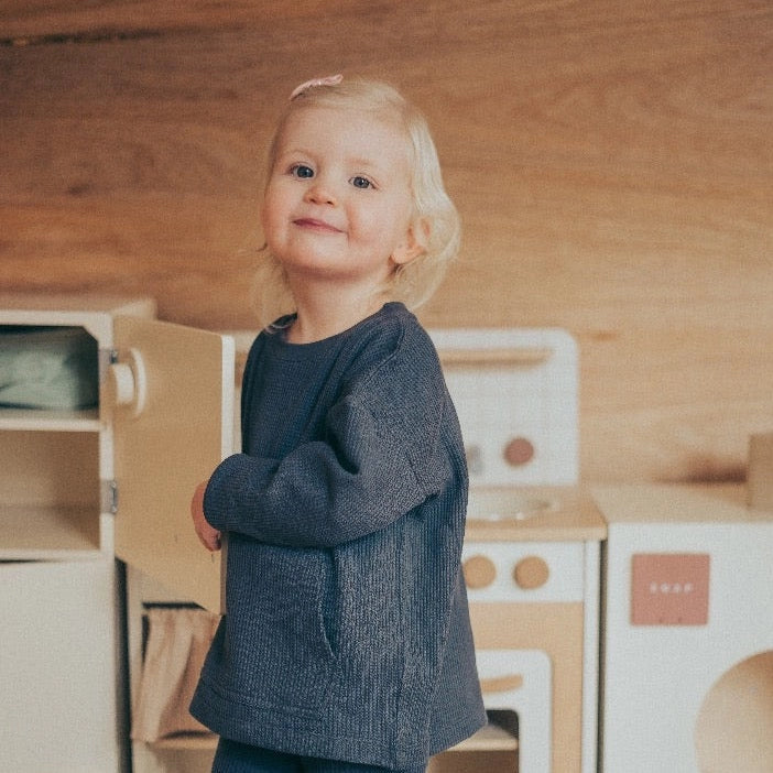 Child wearing charcoal organic cotton waffle top and leggings