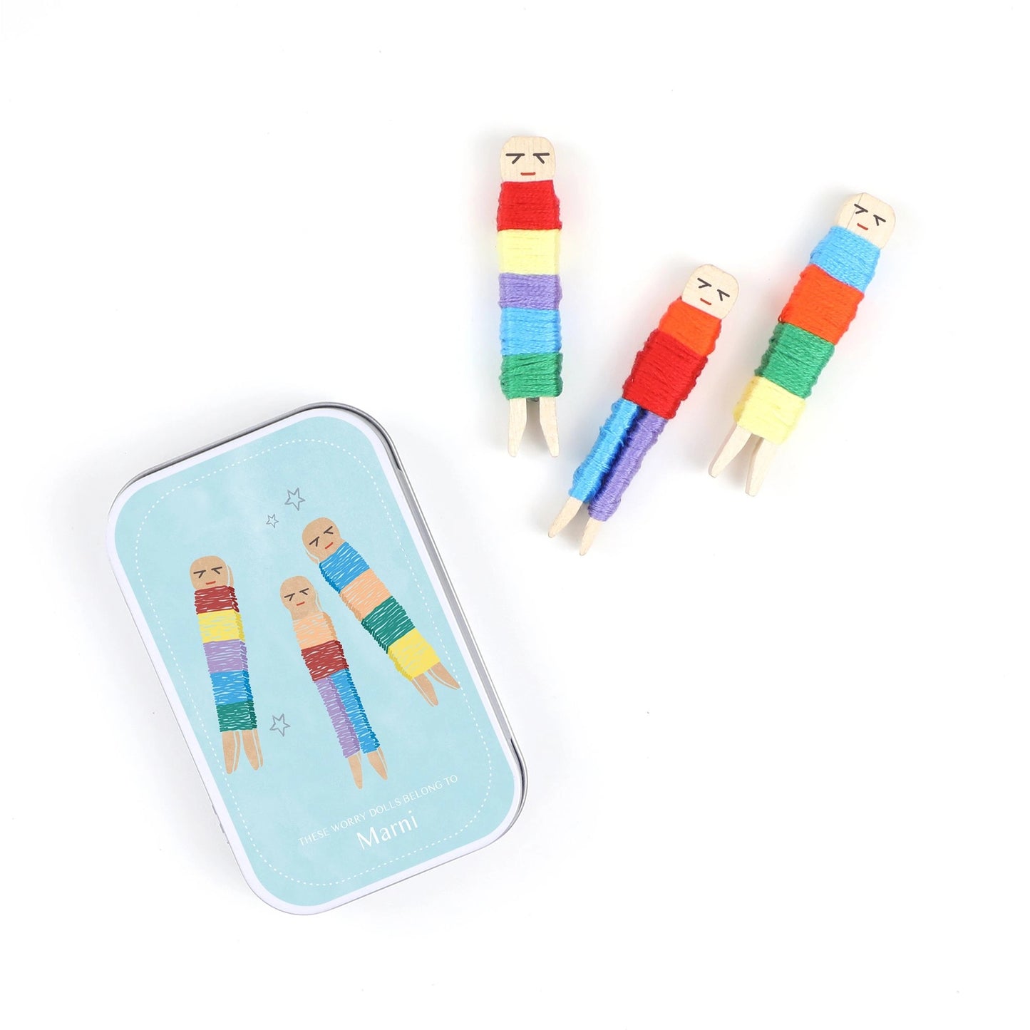 Colorful striped worry dolls on a white background with a branded tin.