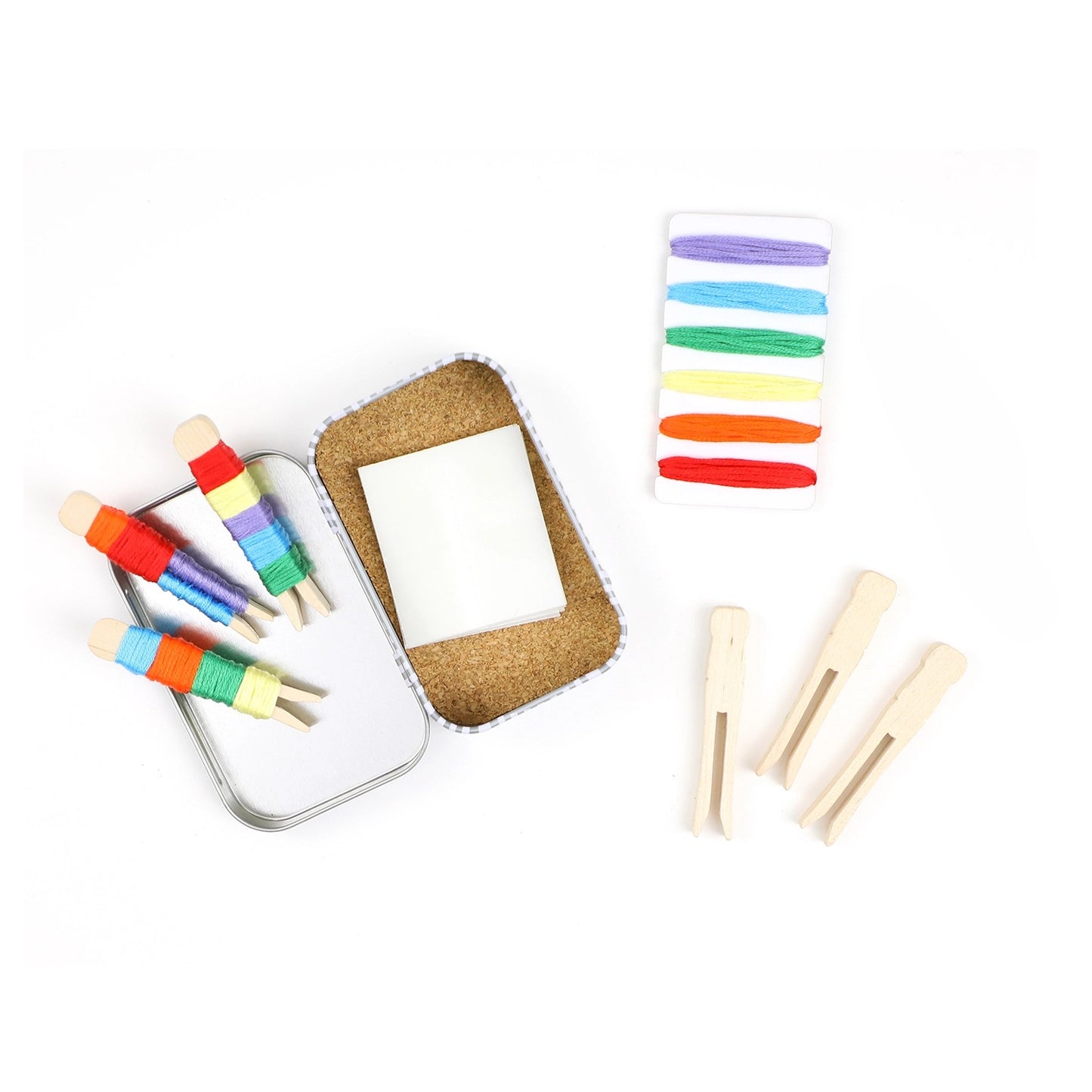 Colorful wooden pegs on a white background