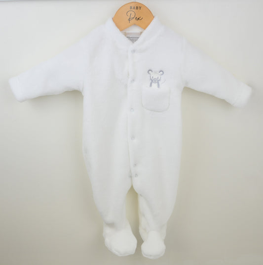 White baby onesie with a mouse emblem on a beige background