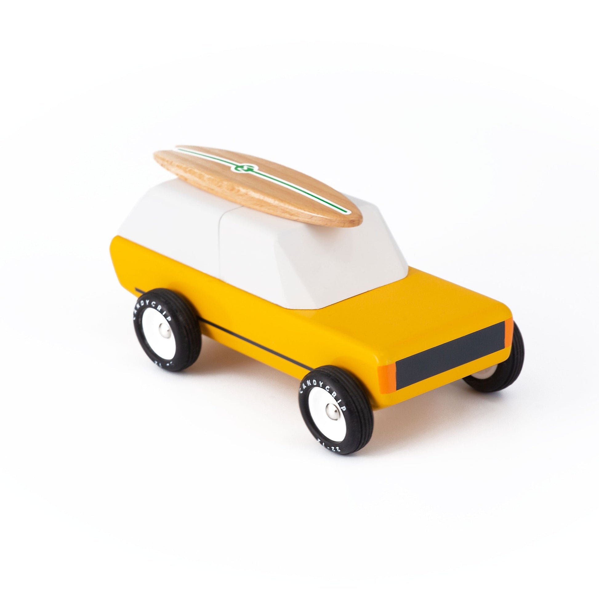 Toy car with a surfboard on top on a white background