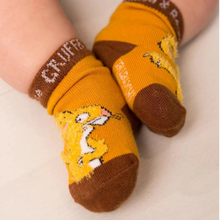 Baby socks with Gruffalo mouse character design on a light background