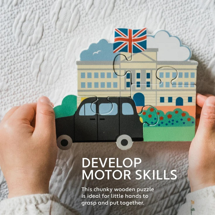 Children's puzzle with a building, car, and British flag on a textured white background.