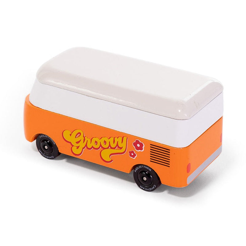 Small orange and white toy vehicle with 'groovy' text on a white background