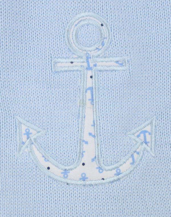 Embroidered anchor design on a light blue fabric background