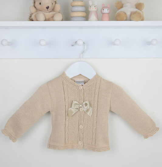 Beige baby cardigan with a bow on a white background