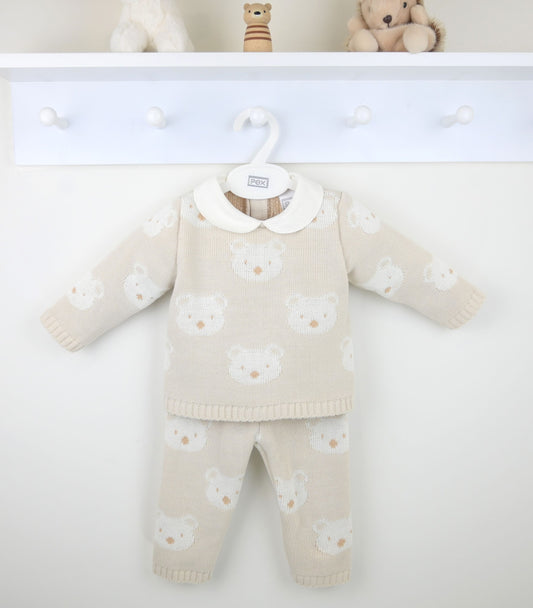 Baby sweater and pants set with teddy bear pattern on a white background