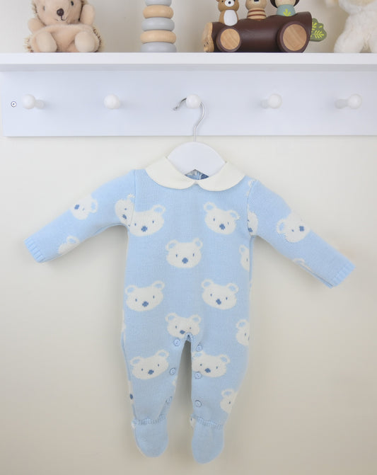 Blue baby onesie with bear pattern on a white background