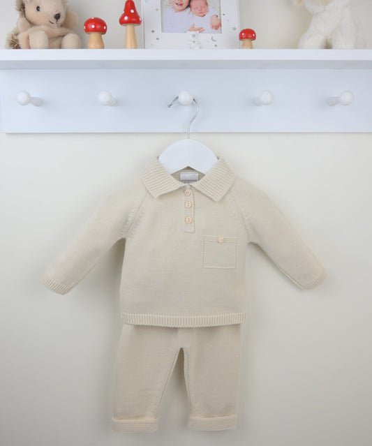 Beige baby outfit with a shirt and pants on a white background
