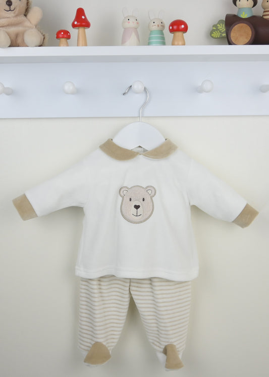 Baby outfit with bear design on a hanger against a white background