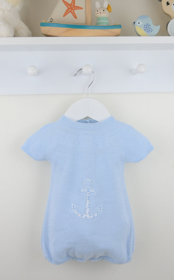 Light blue baby romper with an anchor design on a white hanger against a white background.