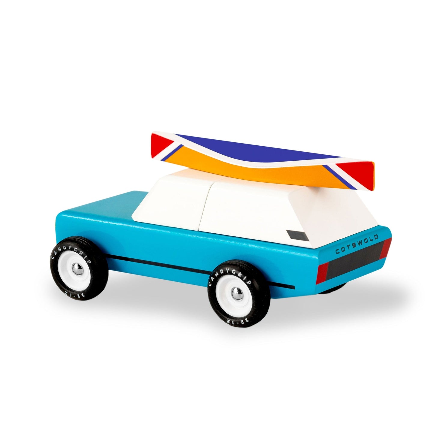 Toy car with a colourful roof on a white background