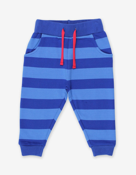 Blue striped jogging bottoms with a red drawstring on a white background