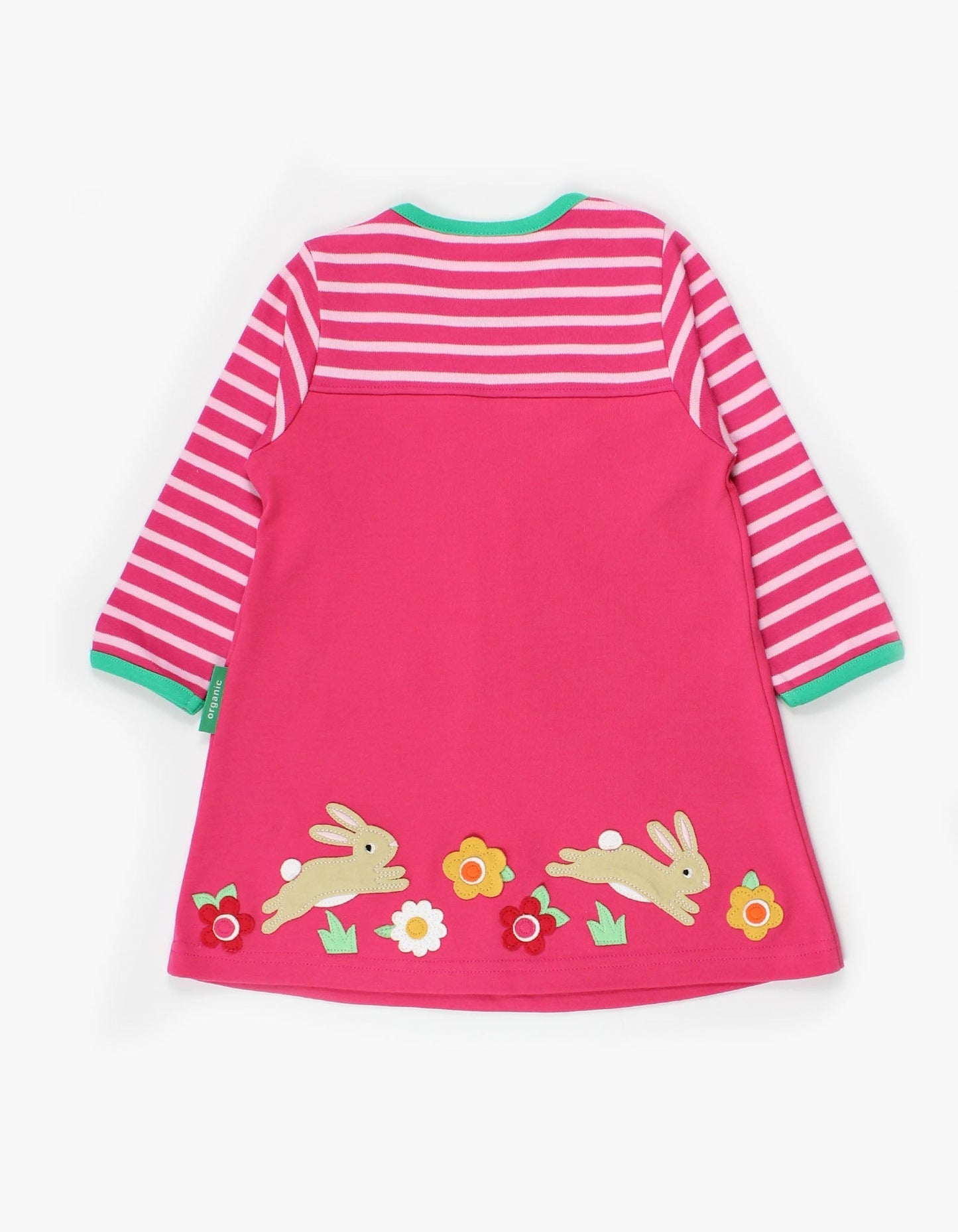 Pink dress with striped sleeves and bunny designs on a white background.