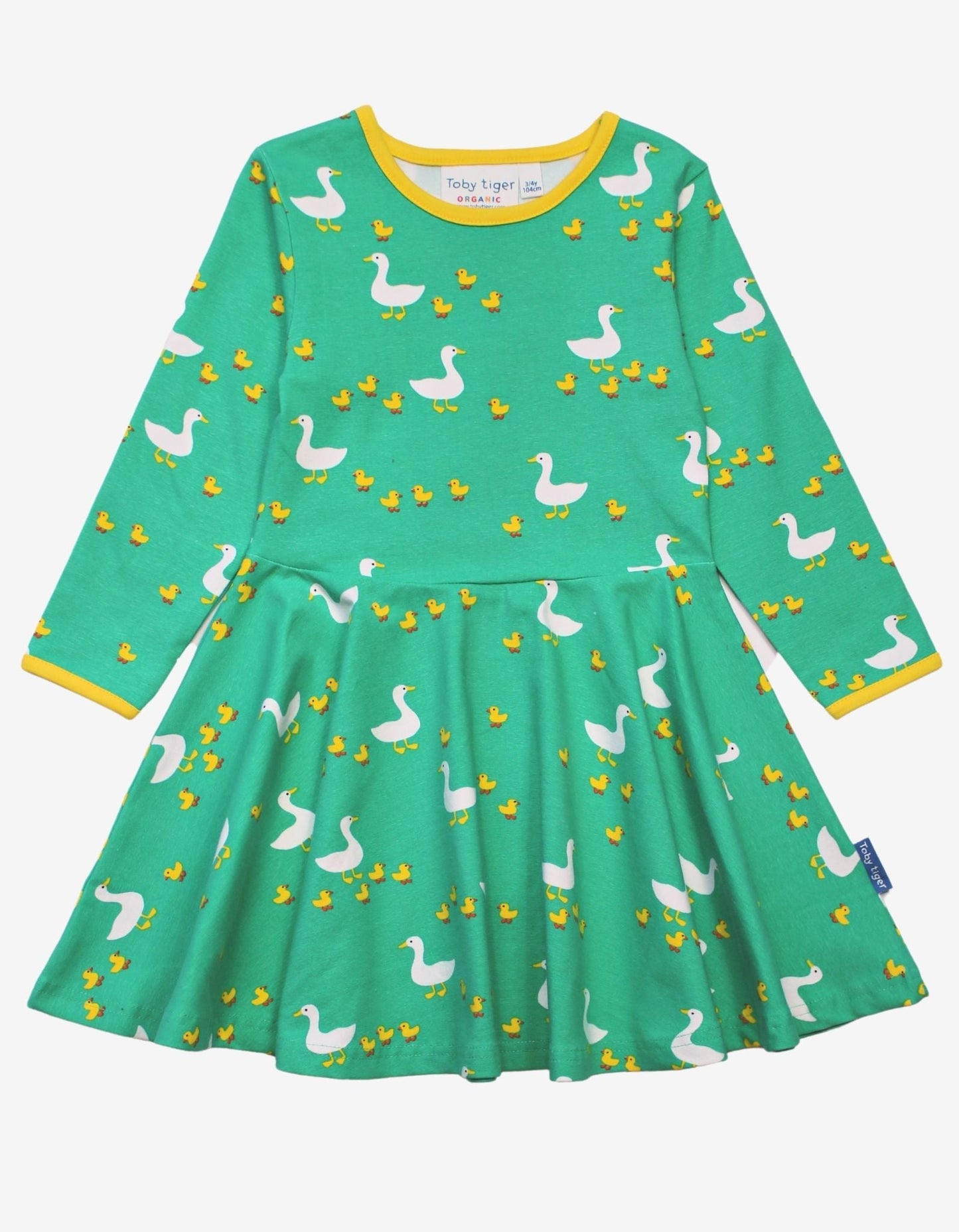 Green dress with duck pattern on a white background