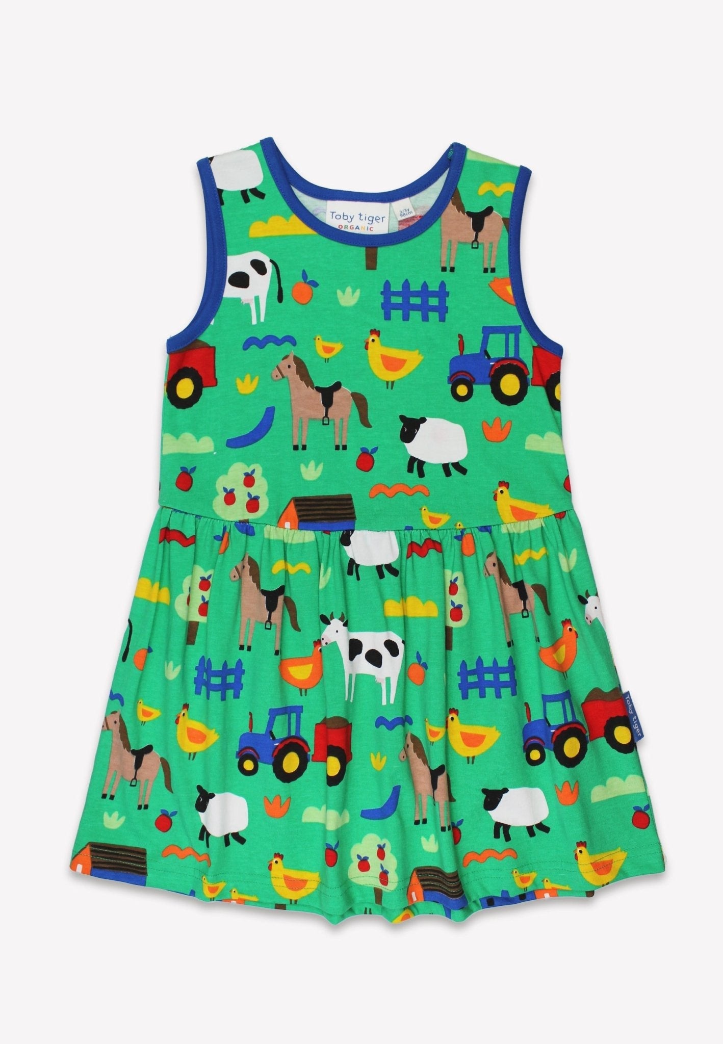 Organic Toby Tiger Green dress with farm animal pattern on a white background.