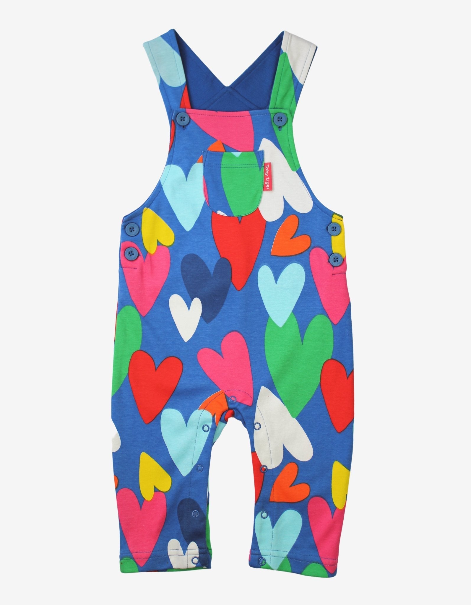 Colourful heart-patterned dungarees on a white background