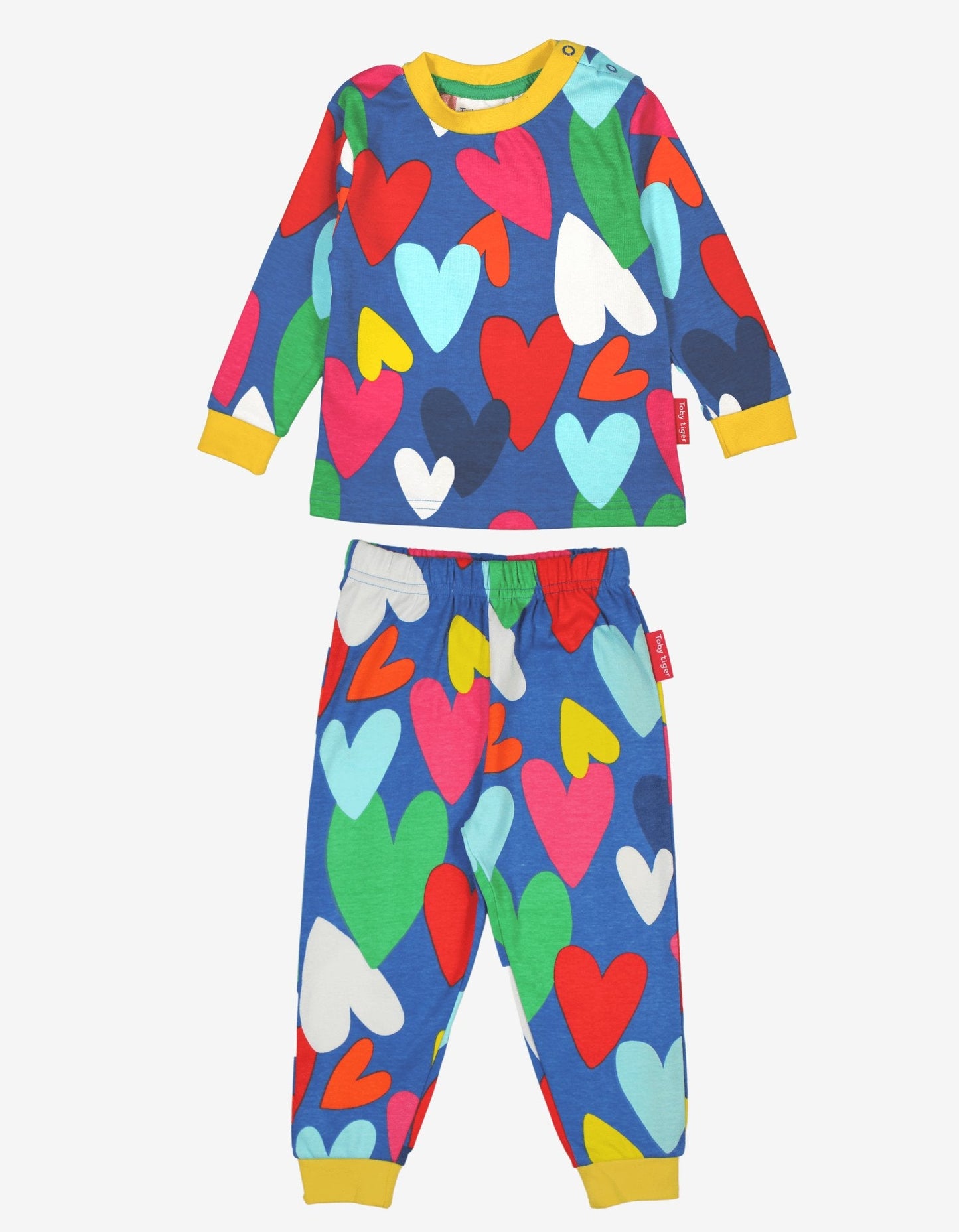 Colourful heart-patterned pyjama set on a white background