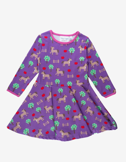 Organic Purple dress with horse pattern on a white background