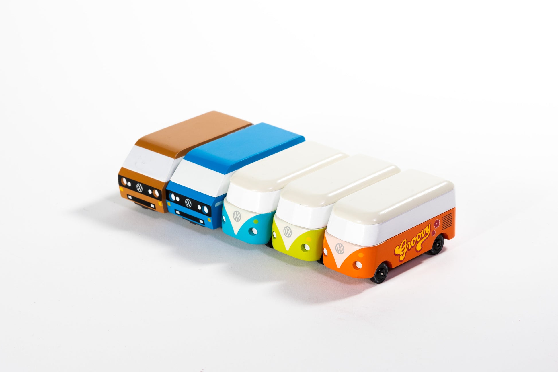 Colorful toy vans arranged in a row on a white background