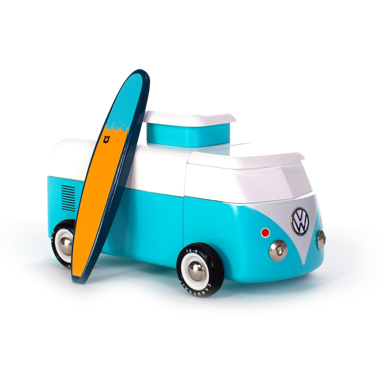 Toy Volkswagen van with a surfboard on a white background