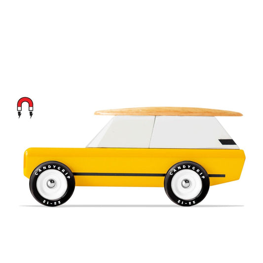 Yellow toy car with a surfboard on a white background