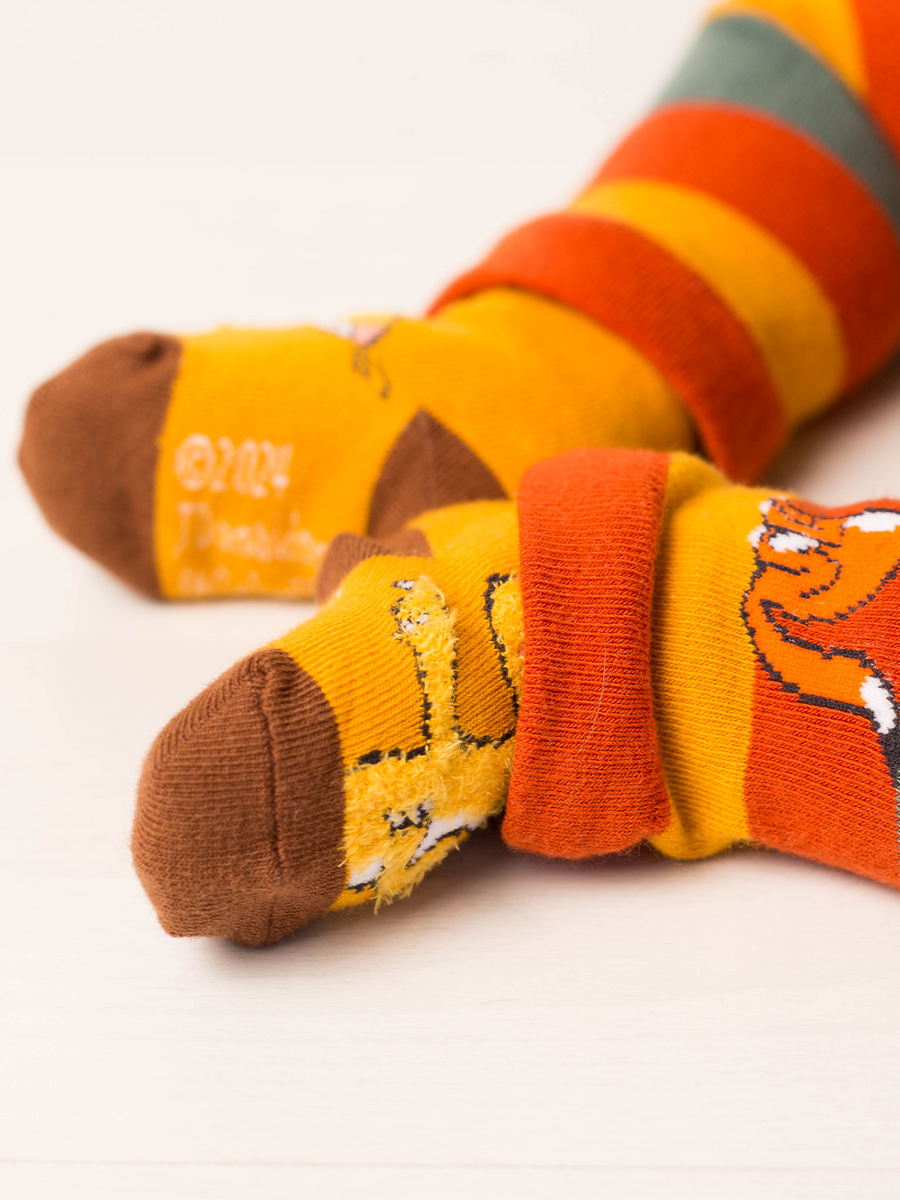 Mustard children's socks with cartoon mouse on a white background