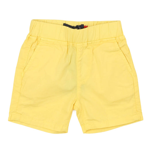 Yellow boys shorts on a white background