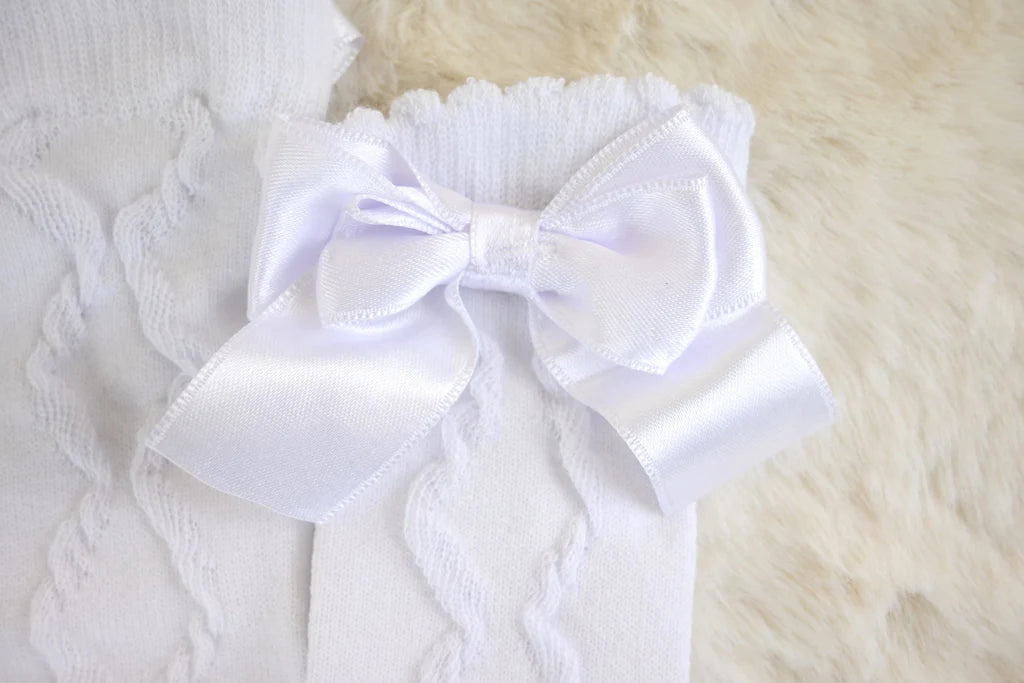 Close-up of bow detail on knee high cotton socks for children