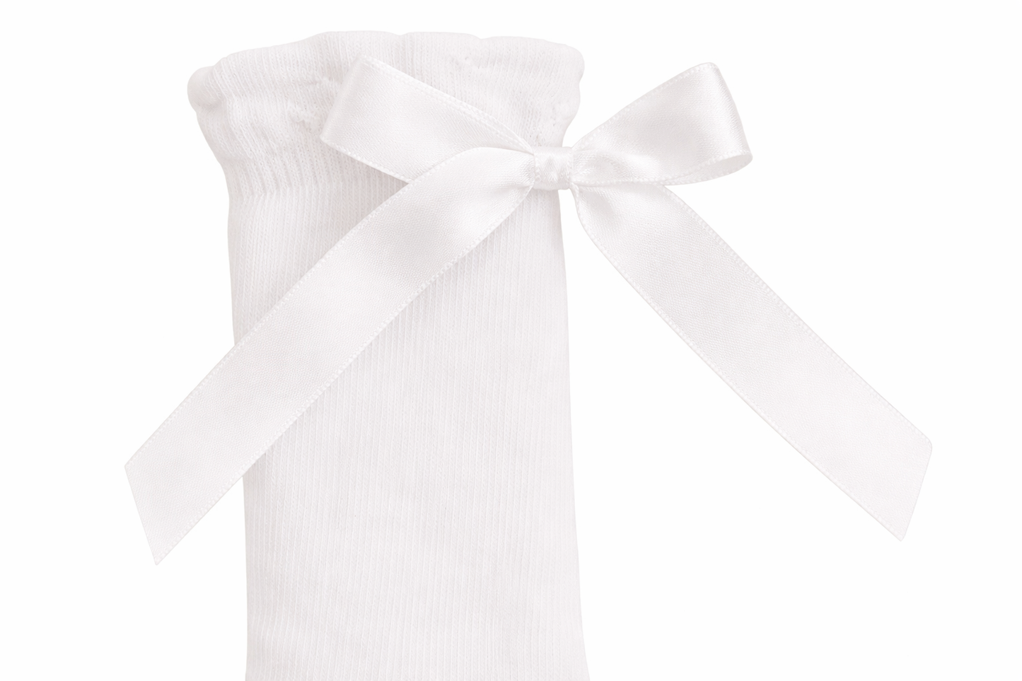 Close-up of ribbon detail on knee high cotton socks for children