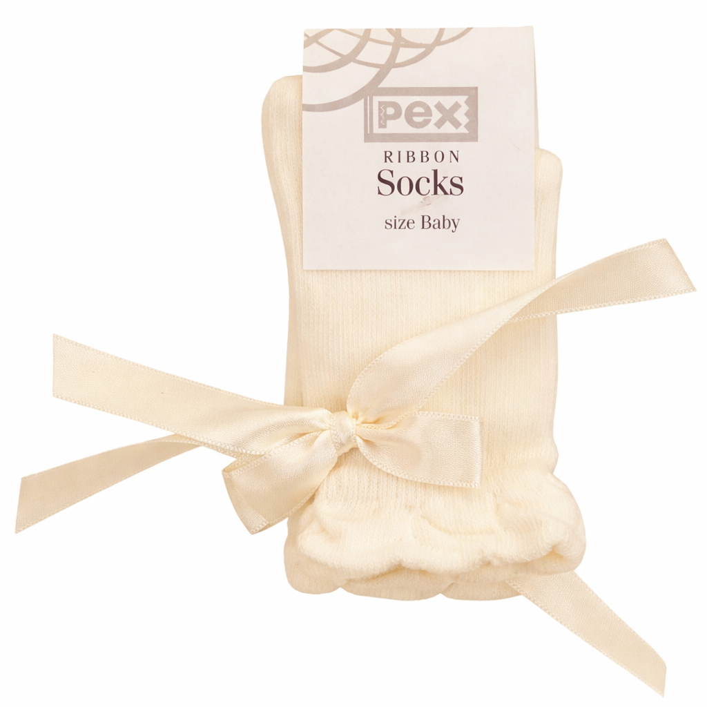 Baby and childrens  ribbon socks with packaging on a white background